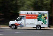 U-Haul moving truck driving on a road