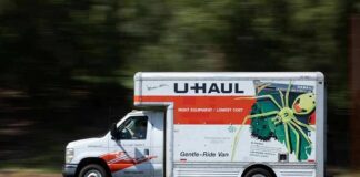 U-Haul moving truck driving on a road