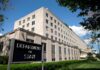 Nuclear Watchdog Escalates – What’s Tehran Hiding? Department of State building exterior on a sunny day