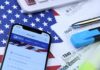 Massive IRS Windfall Hits — Now What? Smartphone showing IRS website on top of tax forms and office supplies