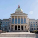 State capitol building with gold dome and columns