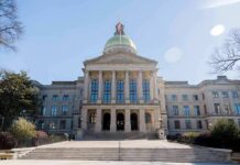 Women Complaints Rock NJ Lt. Gov State capitol building with gold dome and columns