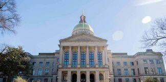 State capitol building with gold dome and columns
