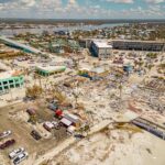 Aerial view of coastal town with widespread storm damage