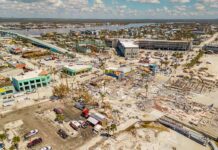 Aerial view of coastal town with widespread storm damage