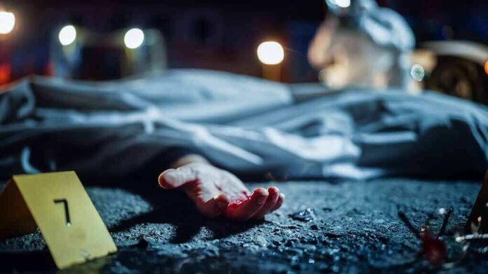 shutterstock_2230645915 crime scene with covered body and evidence marker