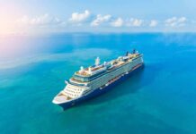 Cruise ship sailing on calm turquoise sea