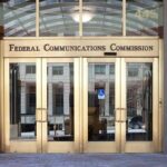 Federal Communications Commission building entrance with gold doors