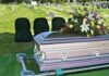 One Pill Theory Shocks Hollywood – Actress Dead casket with floral arrangement at outdoor graveside service