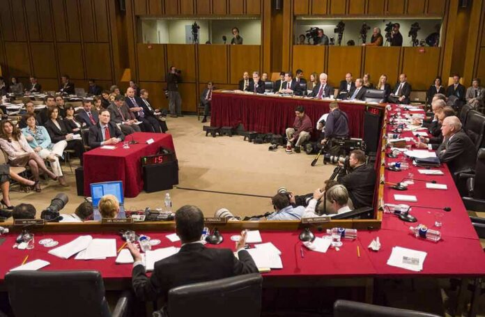 shutterstock_387761506 Patrick Leahy and Samuel Alito at a Senate hearing with committee and press present