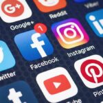 Age-Check Blitz Hits Social Media Smartphone screen showing social media app icons