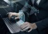 OpenAIβs Project Lily Exposed Person typing on laptop with digital security shield overlay