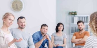 Support group meeting with six adults seated in a circle