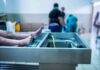 cadaver on stainless autopsy table in clinical room