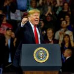 Trump Blitz Begins: 32 Days, No Mercy Donald Trump speaking at a rally behind a presidential podium