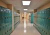 Backpack Soaked In Urine- Professor Tied To Pattern School hallway with rows of teal lockers