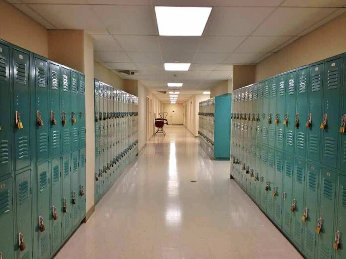 School hallway with rows of teal lockers