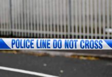 Police tape reading do not cross at a cordoned area