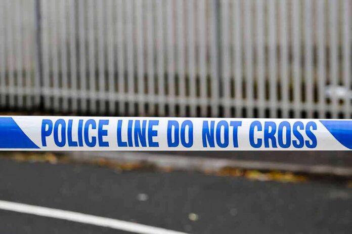 Police tape reading do not cross at a cordoned area