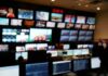 Internet Meltdown: PHP Flaws Trigger Chaos control room with multiple screens and monitors