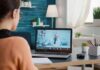 Woman on laptop having video call with doctor in home office