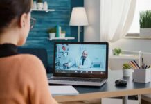 Medicare Heist Exposed – Telehealth Boss Gets CRUSHED Woman on laptop having video call with doctor in home office