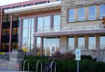 Impostor Teacher Terrorizes Milwaukee Classrooms Waukesha County Courthouse entrance with glass facade and signage