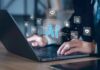 Bezos Dangles Three-Day Workweek – No Policy Hands typing on laptop with AI and tech icons overlay