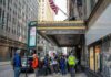 Andreas Hestler and pedestrians outside The Roosevelt Hotel entrance on a city sidewalk