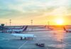 Airport Chaos: Passenger Hijacks Tarmac Tug Airplanes on airport tarmac at sunset