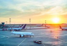 Airport Chaos: Passenger Hijacks Tarmac Tug Airplanes on airport tarmac at sunset